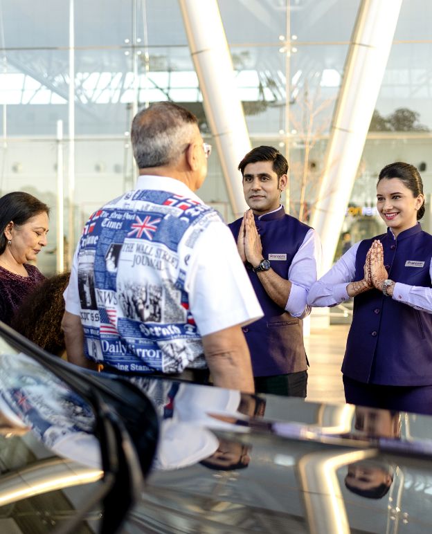 Professional assistant holding a sign at arrivals